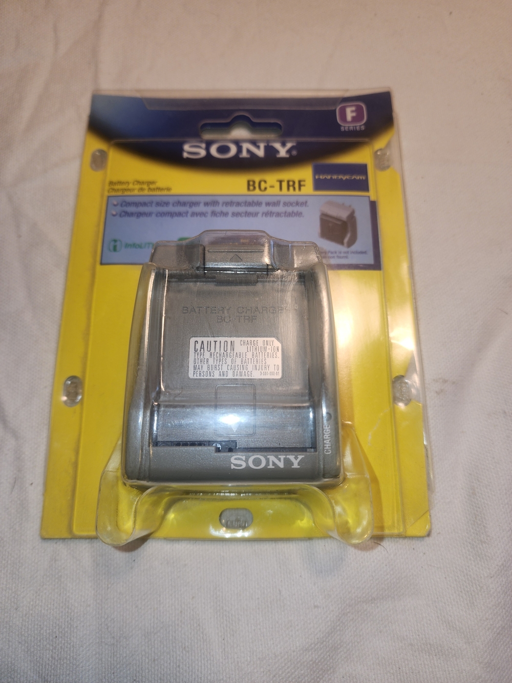 New Sony BC-TRF Compact Battery Charger — Silver with Yellow Backing
